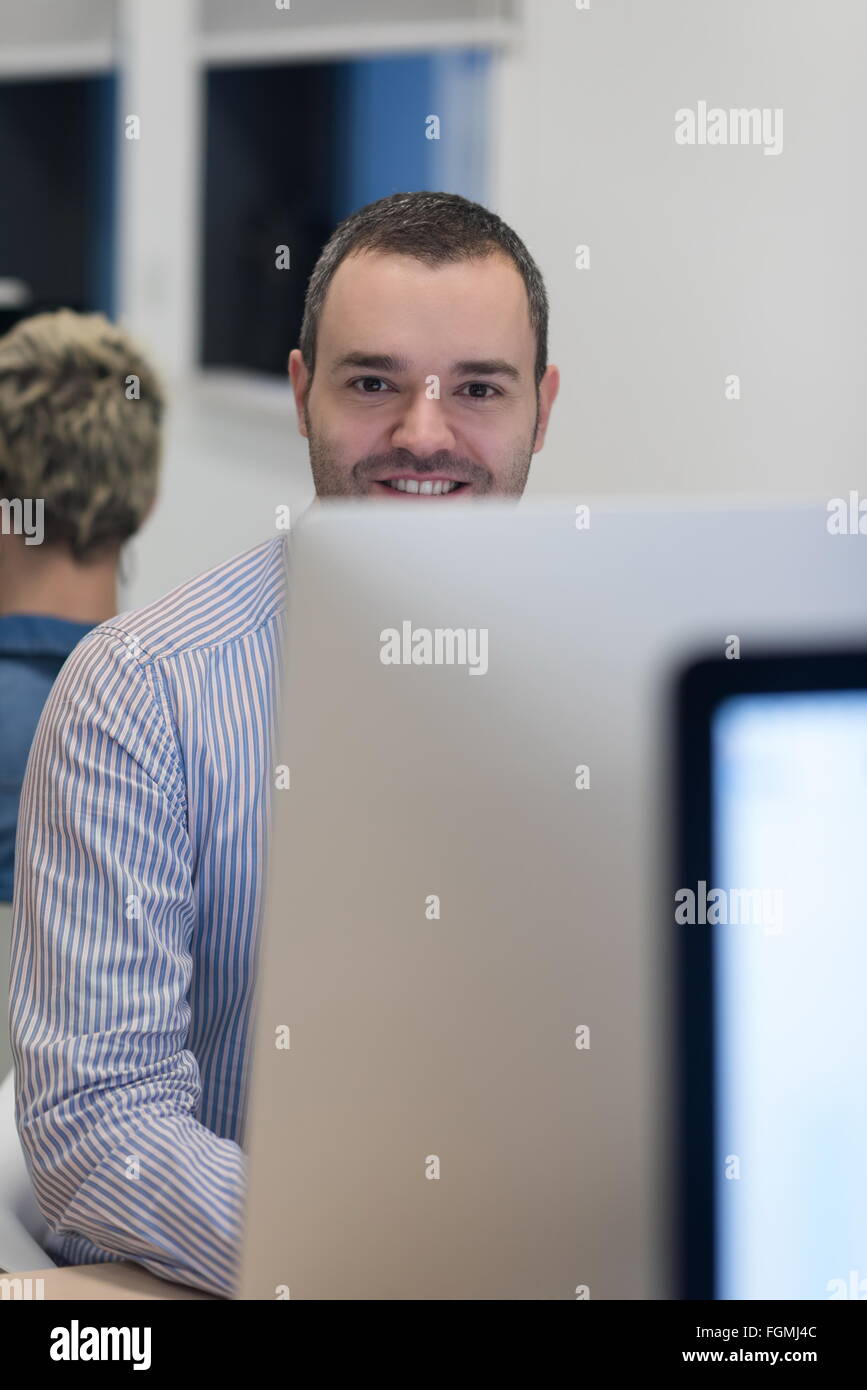 startup business, software developer working on desktop computer at