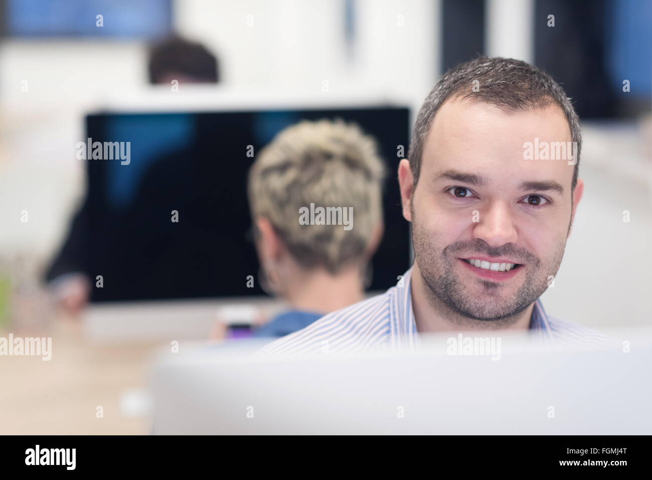 startup business, software developer working on desktop computer at