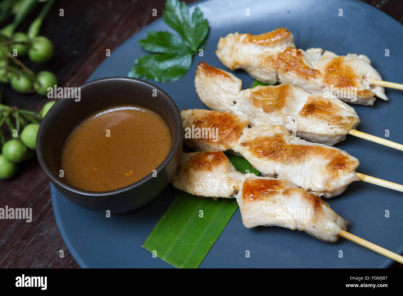 Grilled chicken on skewers with spicy sauce Stock Photo