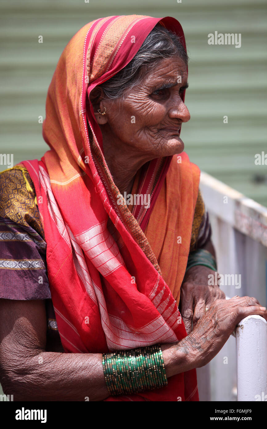 Pune, India - July 11, 2015: A portrait of an old Indian woman who is a Hindu pilgrim, during the famous Wari pilgrimmage in Ind Stock Photo
