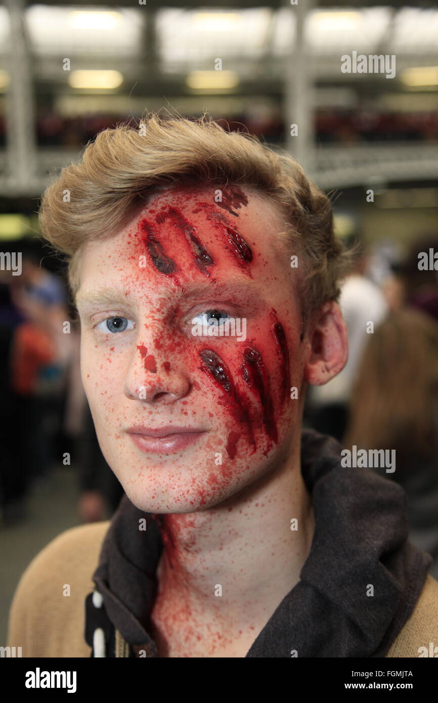 London, UK. 21st February, 2016. Walking Dead Convention Walker Stalker Con Olympia London 21/02/2016 walking dead TV fans gather to see stars of the show and stalls selling everything to do with the hit zombie American show photo ops with a star or zombie. cosplayers & undead walkers roaming the event floor entertaining the crowds. Stalls selling make-up and characters from the show. Credit:  Paul Thompson/Alamy Live News Stock Photo