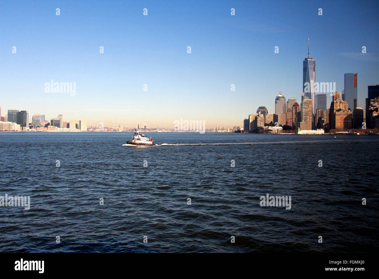 New York City boat with city scape in distance Stock Photo