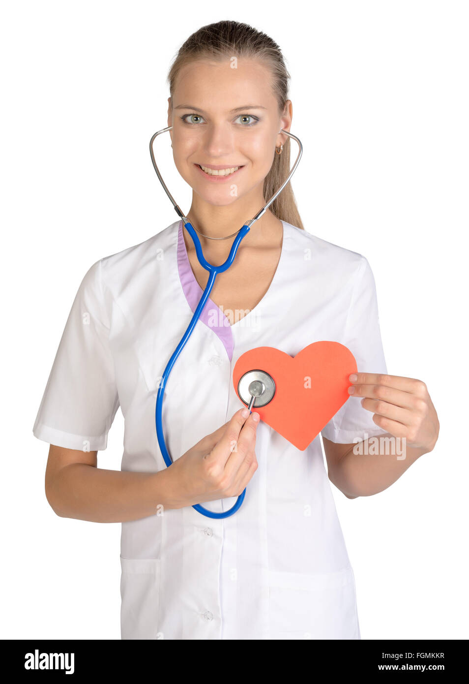 Woman cardiologist listens paper heart in hand Stock Photo