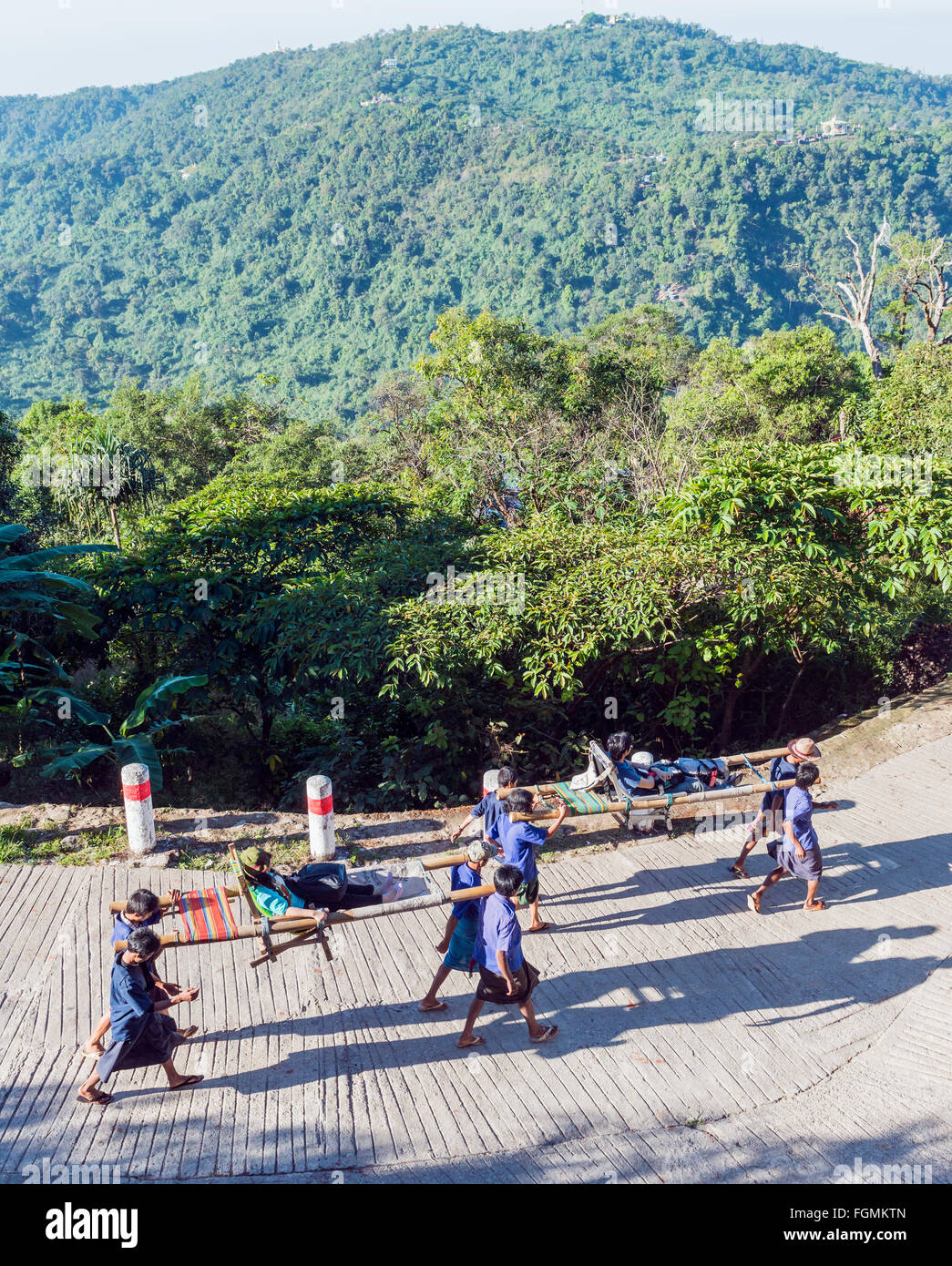 Carrying tourists uphill to Golden Rock, Burma Stock Photo