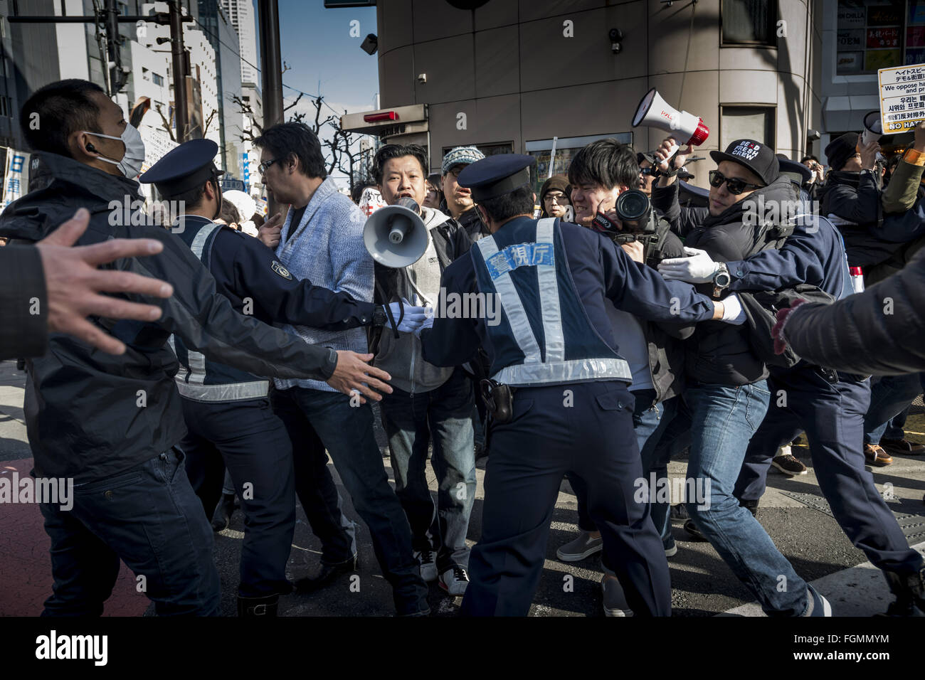 The police blocks the antagonist group protesting against the demo for their discrimination toward Koreans during the protests of nationalists in Shinjuku to sue the severance of diplomatic relations between Japan and South Korea and Takeshima to regain from South Korea. The Liancourt Rocks, also known as Dokdo in Korean or Tokyo, and Takeshima in Japanese, are a group of small islets in the Sea of Japan. While South Korea controls the islets, its sovereignty over them is Contested by Japan. The Liancourt Rocks or Takeshima lie in rich fishing grounds Which may Contain large deposits of natura Stock Photo