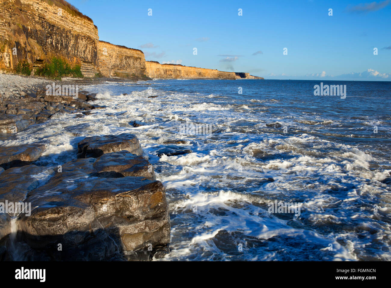 Looking eastwards from St Donats, vale of Glamorgan at high tide, shortly before sunset Stock Photo