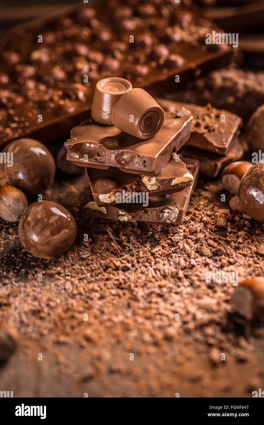 Assorted chocolate pralines and bars background Stock Photo