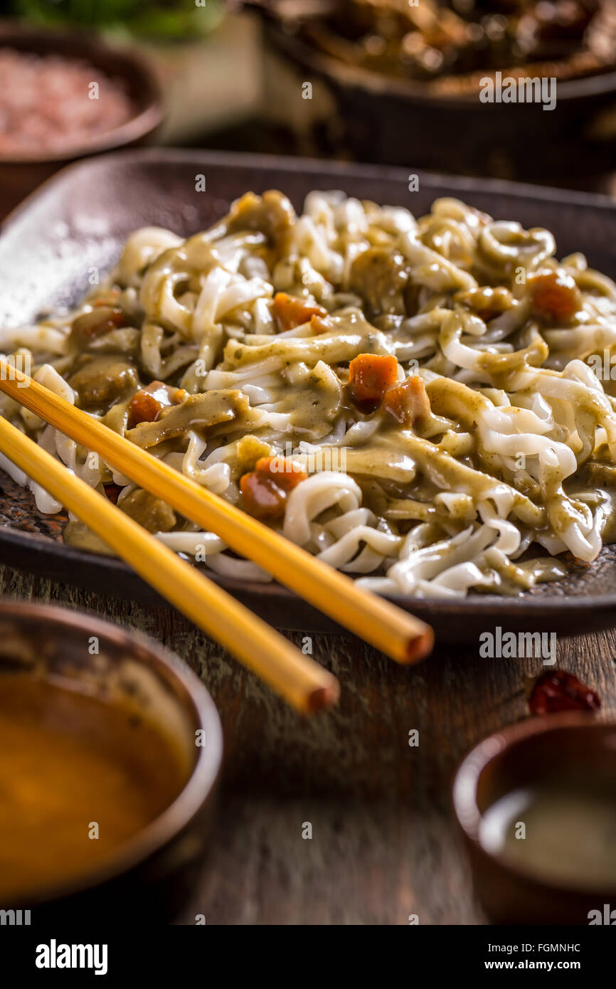 Thai noodles served in restaurant with chopsticks Stock Photo Alamy