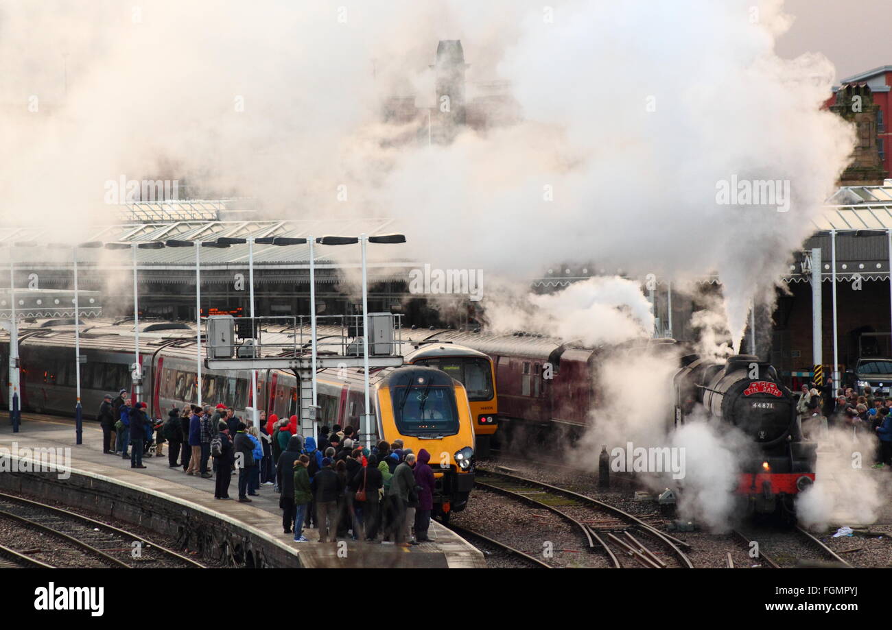 'The Tin Bath' steam engine alongside a modern day train at Sheffield Railway Station, South