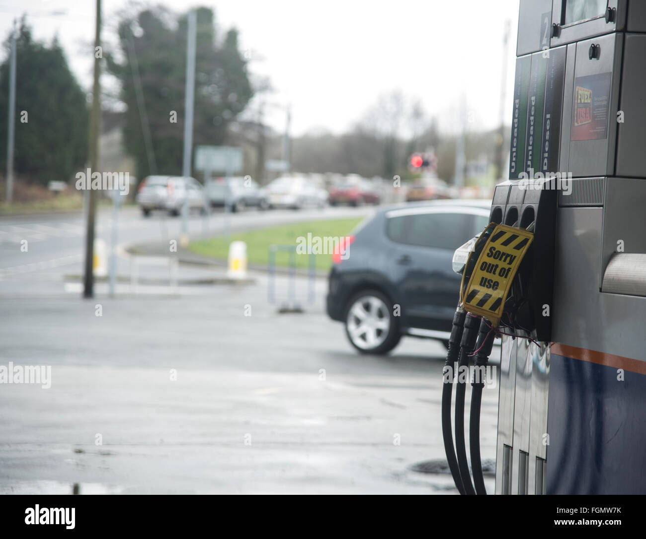 A sign 'sorry out of use' displayed on fuel pumps. Stock Photo