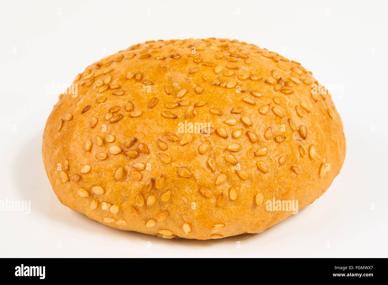 whole wheat bun with sesame seeds on white background Stock Photo - Alamy