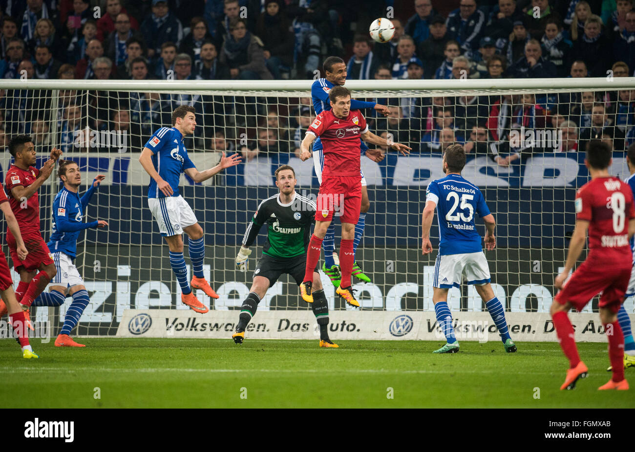 Gelsenkirchen, Germany. 21st Feb, 2016. Schalke's Joel Matip (c) und Stuttgart's Daniel Schwaab in action during the Bundesliga soccer match between FC Schalke 04 and VfB Stuttgart at the Veltins Arena in Gelsenkirchen, Germany, 21 February 2016. PHOTO: BERND THISSEN/dpa (ATTENTION EDITORS: Due to the accreditation guidelines, the DFL only permits the publication of up to 15 pictures per match on the internet and in online media during the match.) © dpa/Alamy Live News Stock Photo