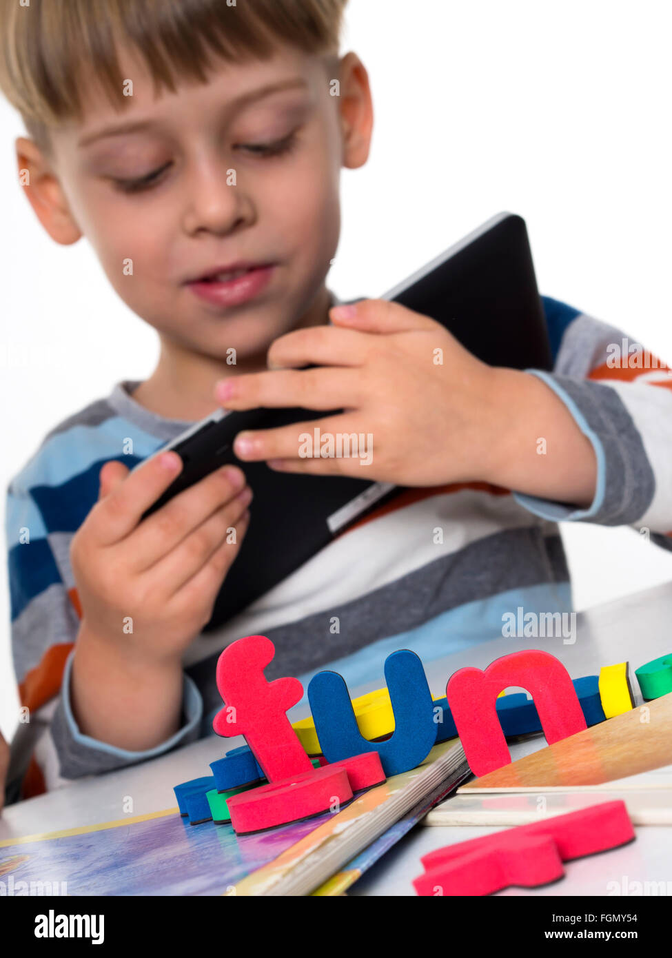 boy playing video games on tablet Stock Photo Alamy