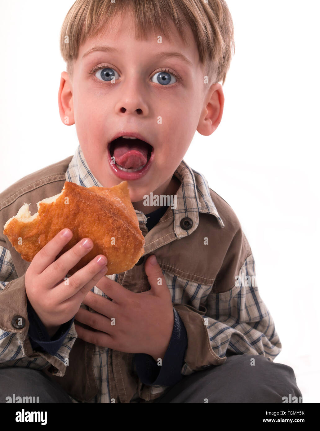 boy eating donut Stock Photo