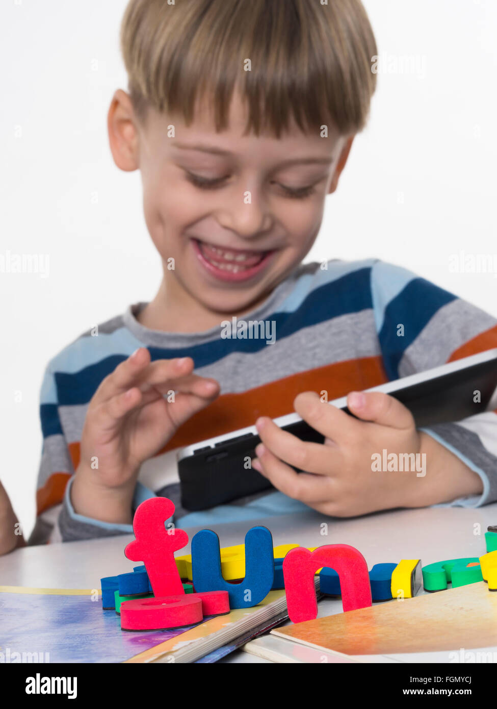 boy playing video games on tablet Stock Photo Alamy
