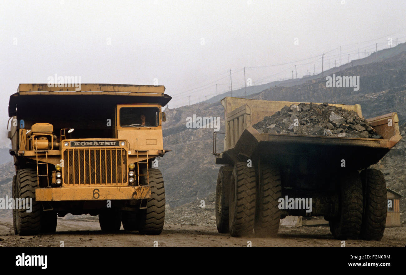 Coal trucks, Fushun open cast coal mine, Liaoning province, China Stock Photo