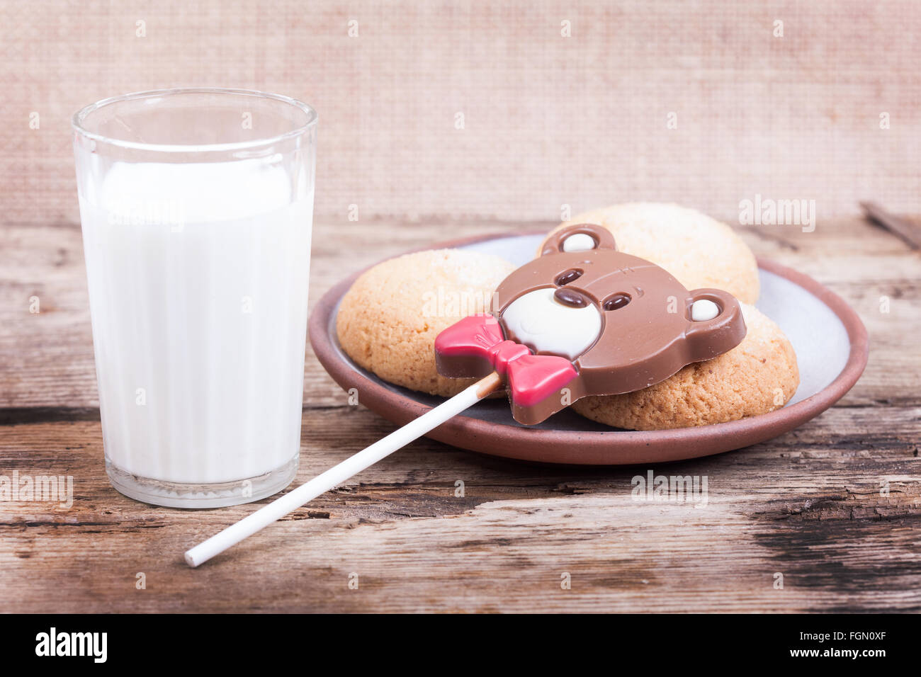 Chocolate sweet, chip cookies, milk on rustic wood background Stock Photo