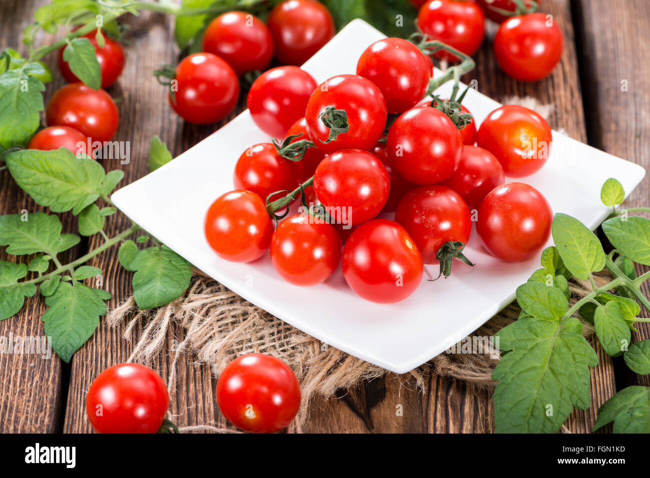 Portion of fresh Cherry Tomatoes on dark wooden background Stock Photo ...