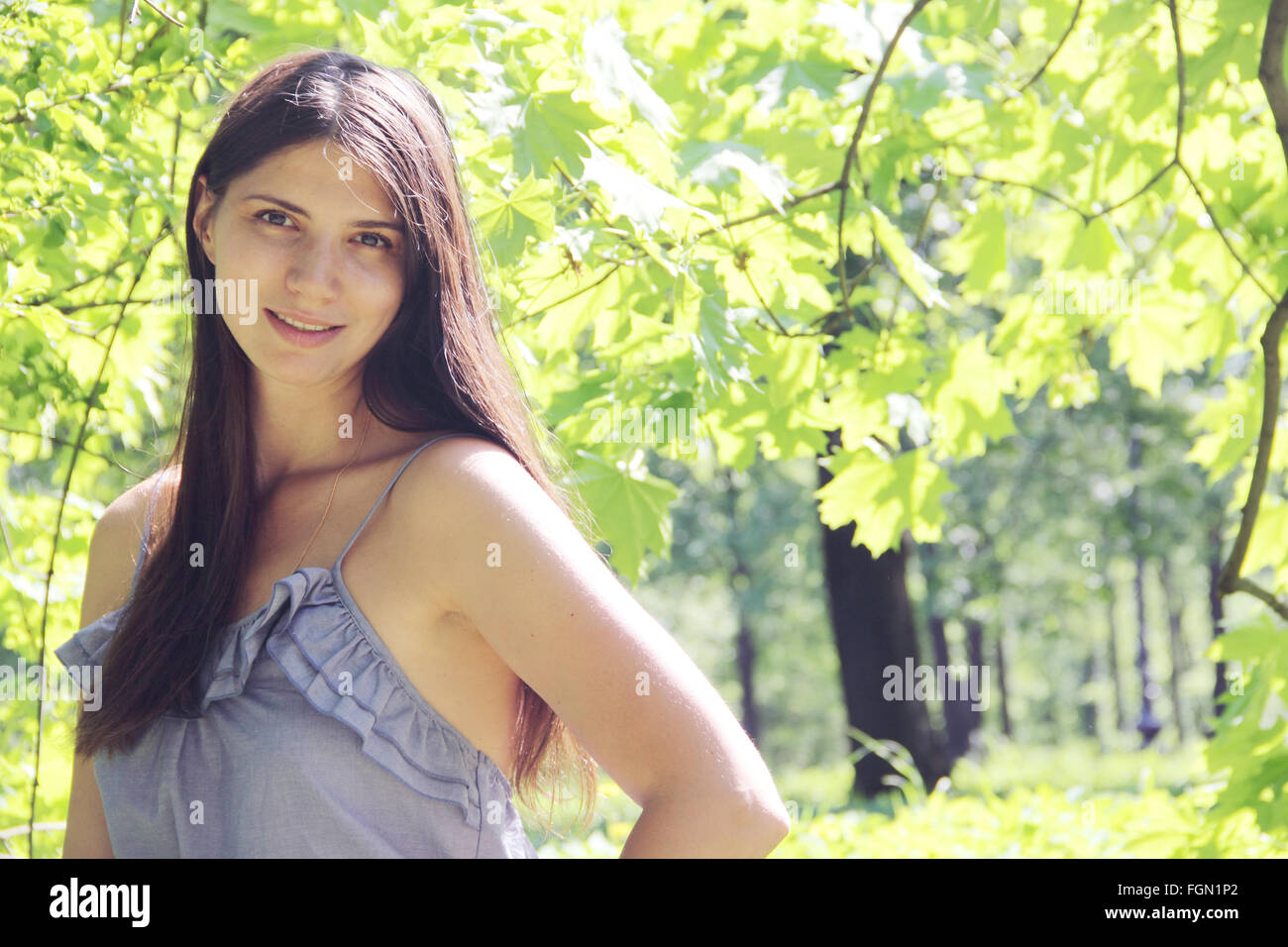 Portrait of a beautiful woman in spring park Stock Photo - Alamy