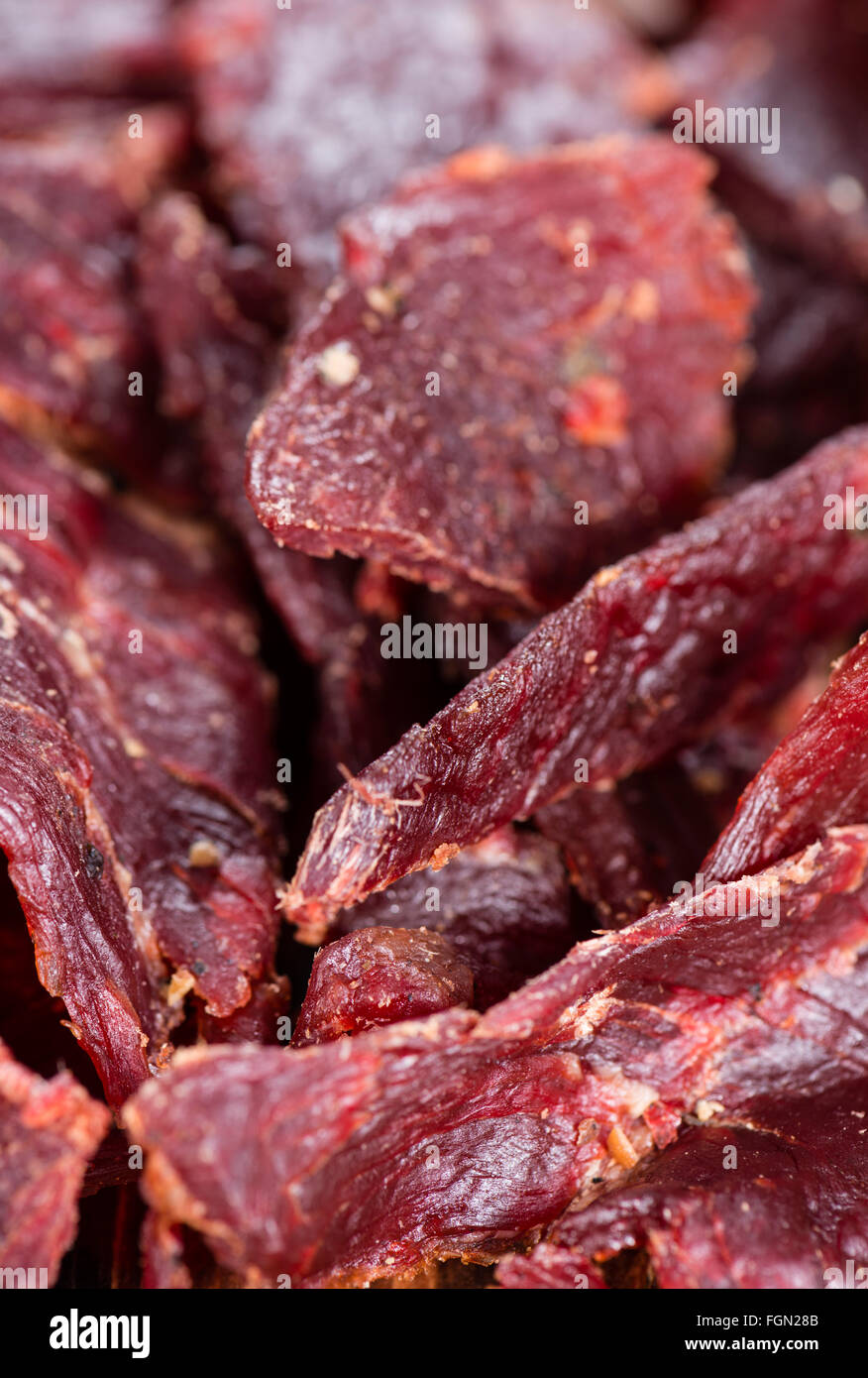 Portion of Beef Jerky as detailed macro shot Stock Photo