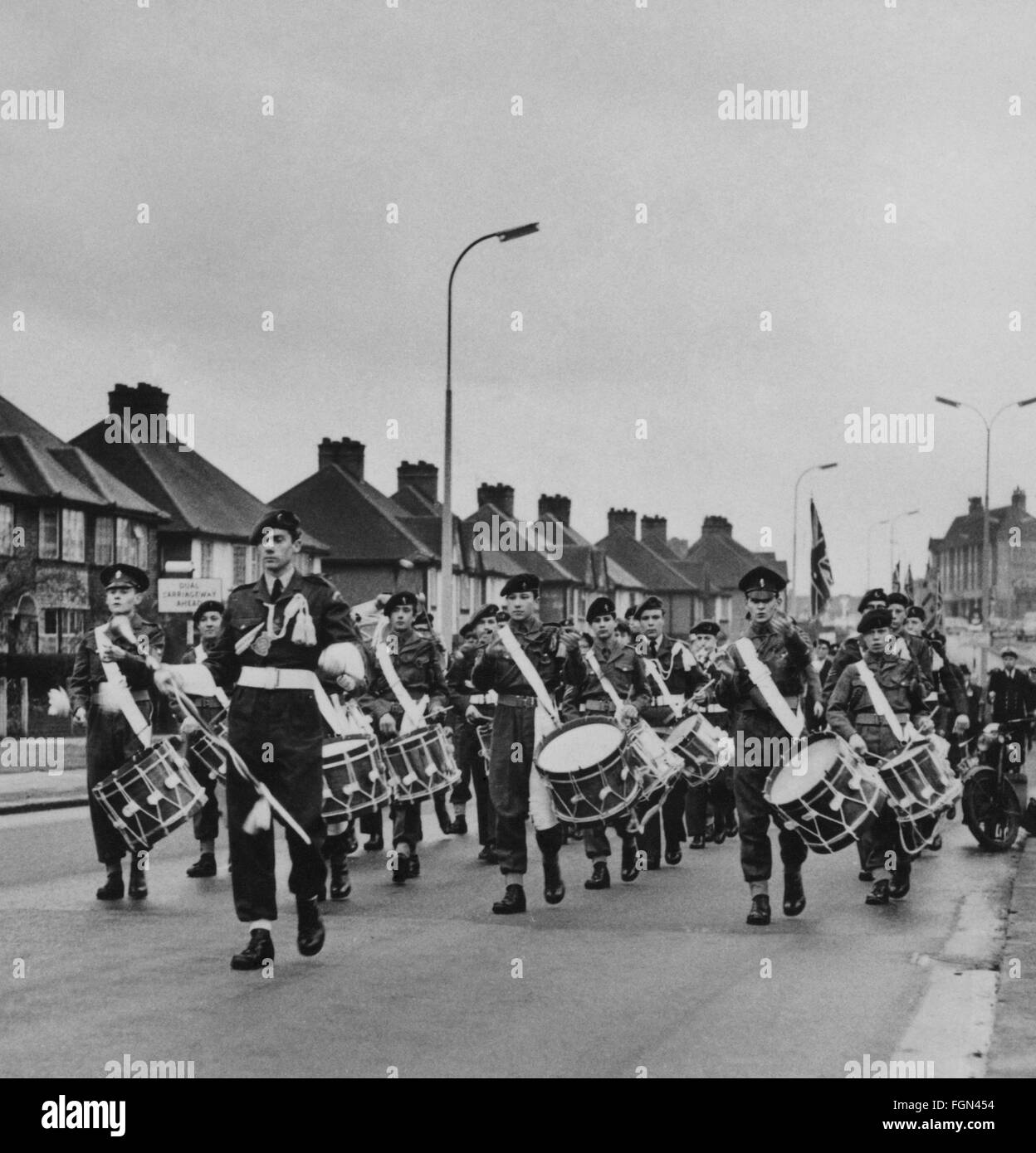 Military forces youth group band marching in the street. Sunday parade. Stock Photo