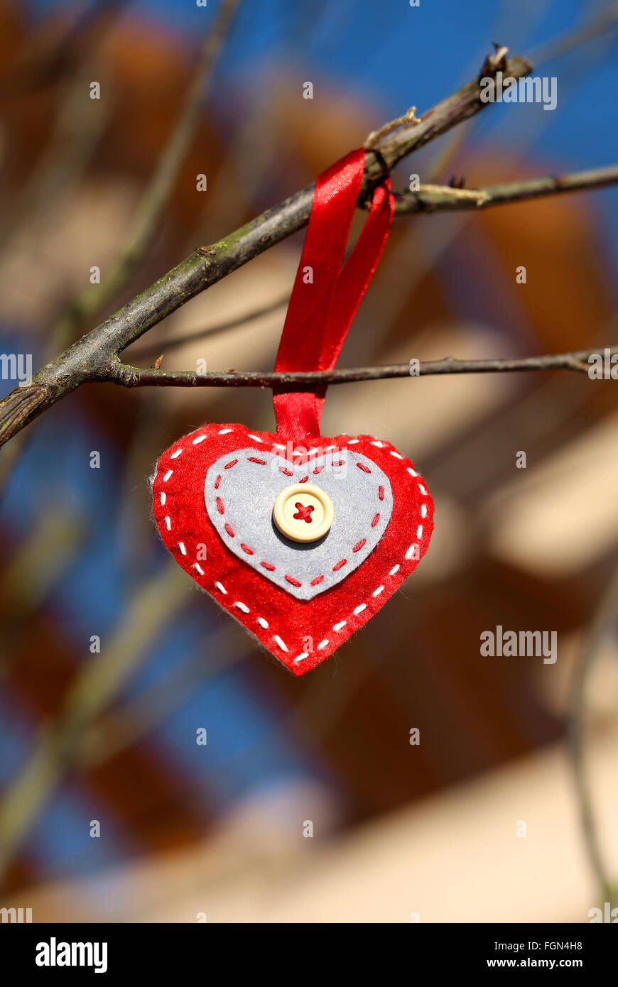 Decorative material red heart on a branch to branch.Valentine day. The winter vacation. Valentine theme. Stock Photo