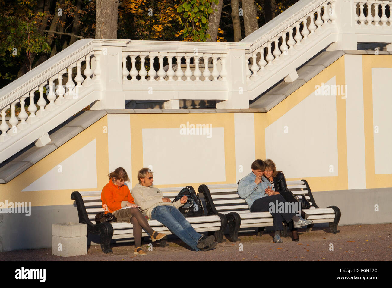 Couples sitting on a bench at Kadriorg Palace, Tallinn, Estonia Stock Photo