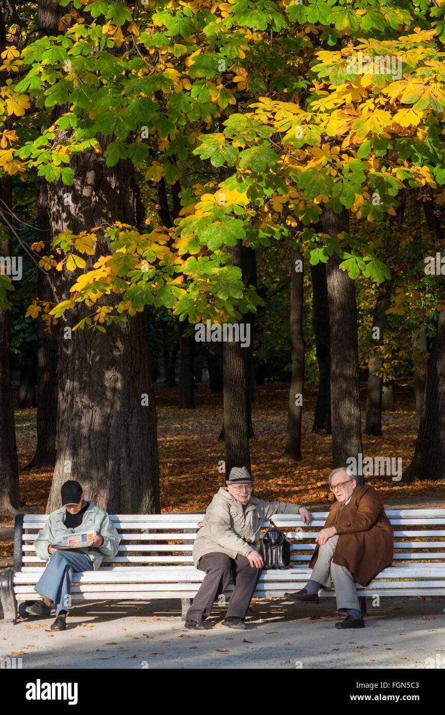 Elderly men sitting on bench in Kadriorg Park, Tallinn, Estonia Stock Photo