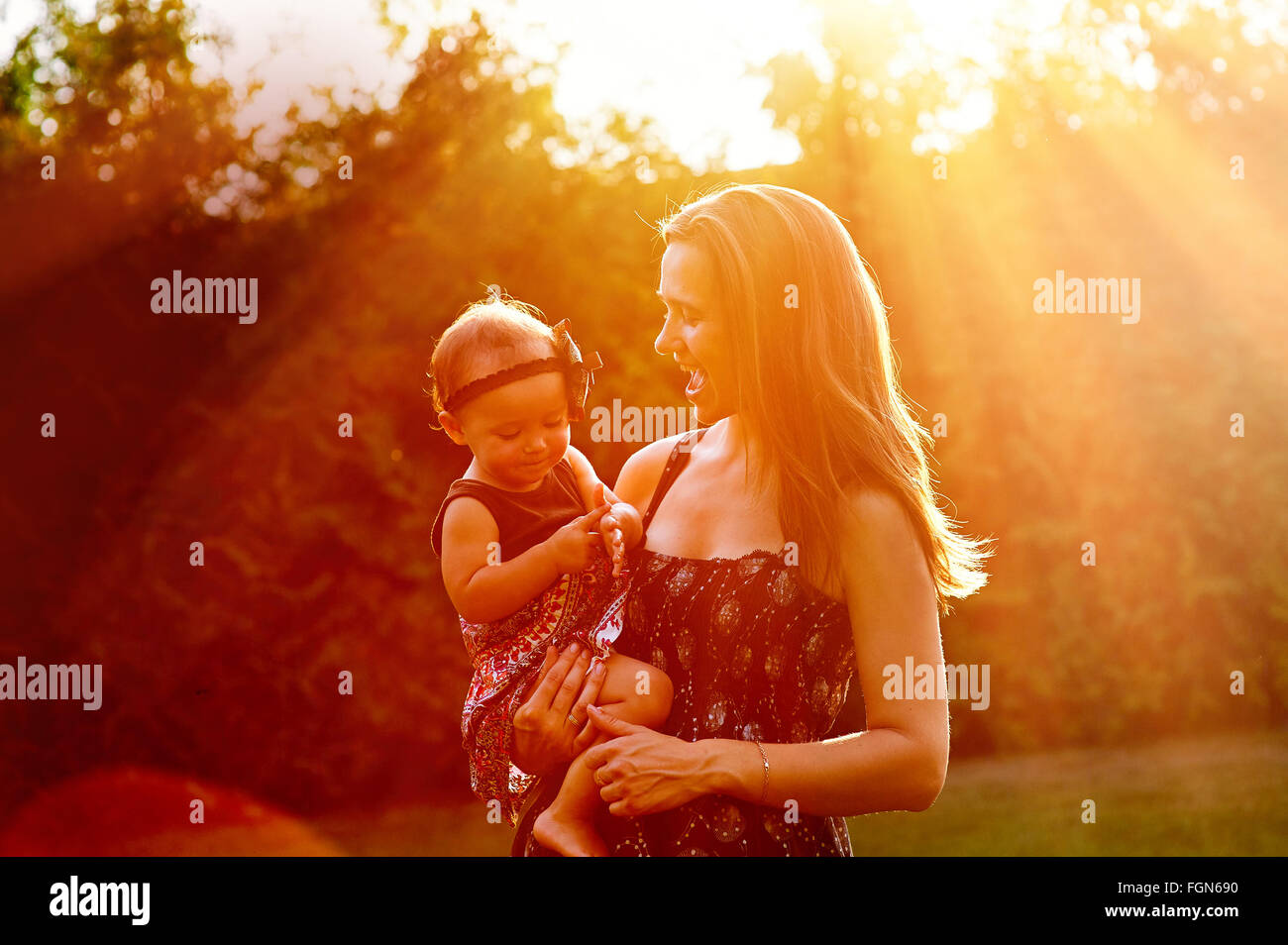 Mom holds daughter on the hands Stock Photo