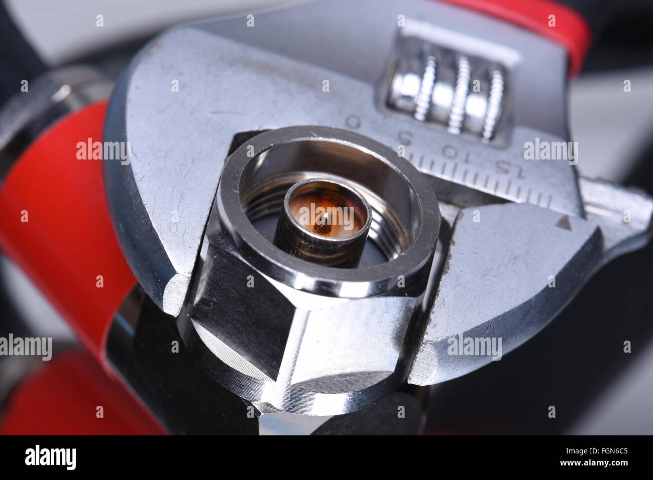 Closeup of coax connector with tool wrench, coaxial network technology