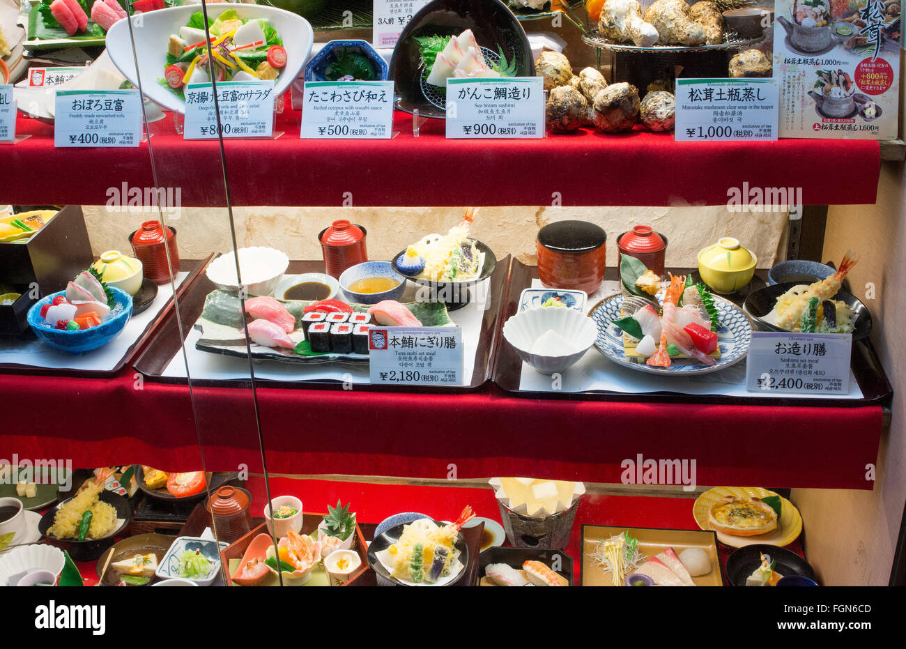 Tokyo Japan plastic food in restaurant in window for tourists sushi plates meals menu and prices on Ginza shopping on famous str Stock Photo