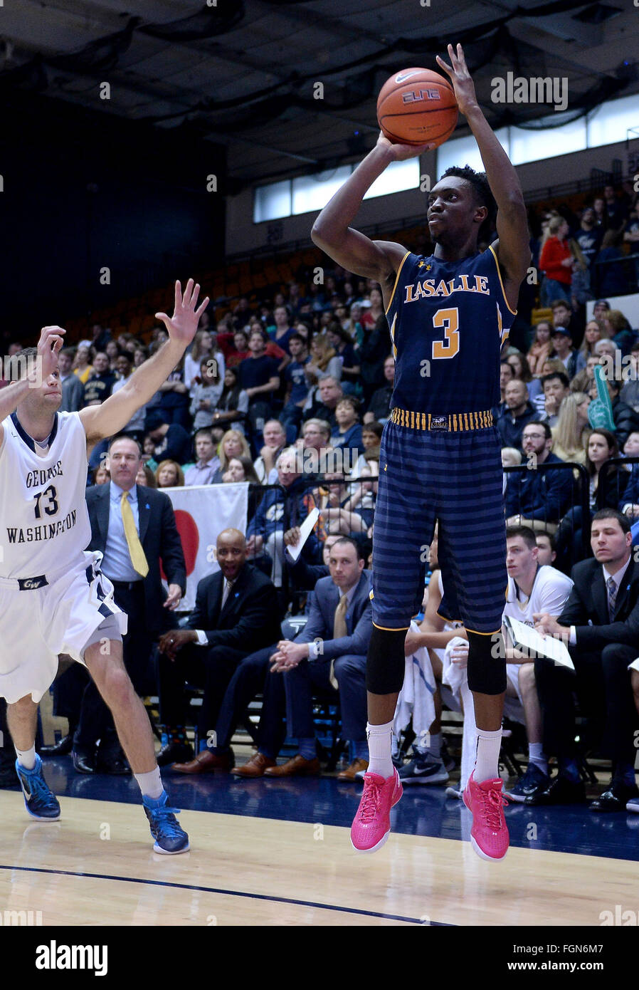 Washington, DC, USA. 21st Feb, 2016. 20160221 - La Salle guard CLEON ROBERTS (3) shoots sinks a three-point shot, as George Washington guard PATRICIO GARINO (13) comes over to defend, in the first half at the Smith Center in Washington. © Chuck Myers/ZUMA Wire/Alamy Live News Stock Photo