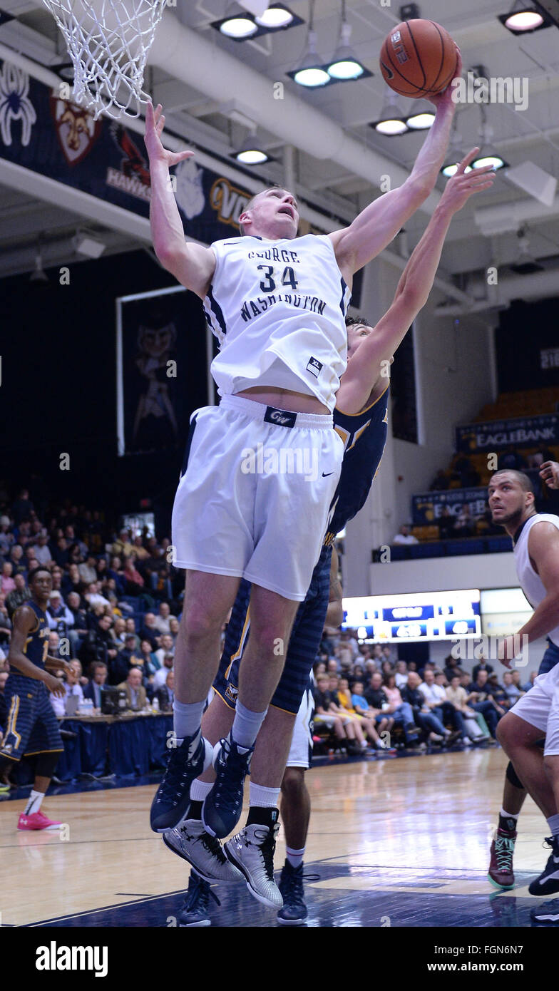 Washington, DC, USA. 21st Feb, 2016. 20160221 - George Washington forward TYLER CAVANAUGH (34) pulls down a rebound against La Salle forward YEVGEN SAKHNIUK (12) in the first half at the Smith Center in Washington. © Chuck Myers/ZUMA Wire/Alamy Live News Stock Photo