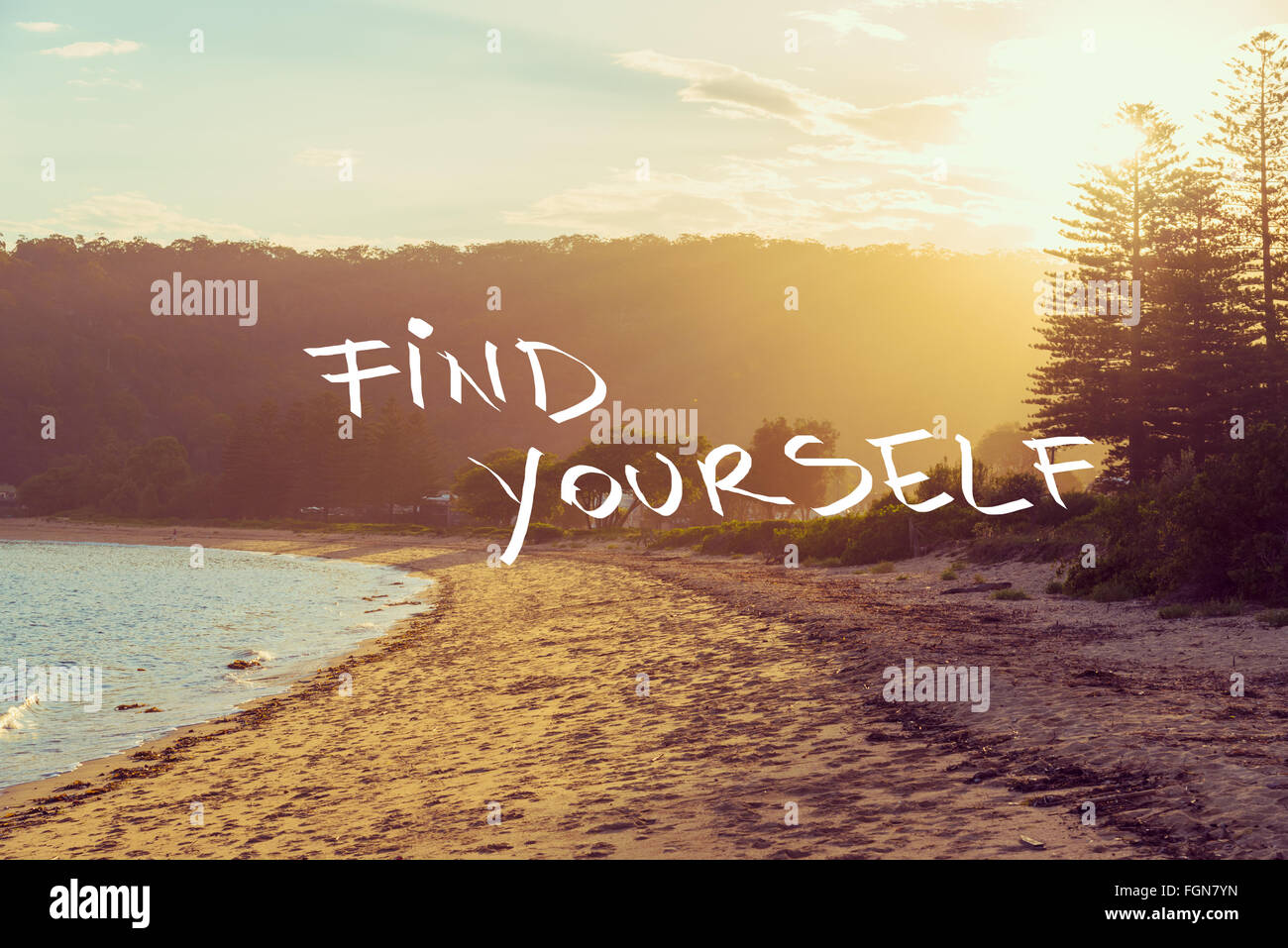 Handwritten text over sunset calm sunny beach background, FIND YOURSELF,  vintage filter applied, motivational concept image Stock Photo - Alamy, image size:1300x957