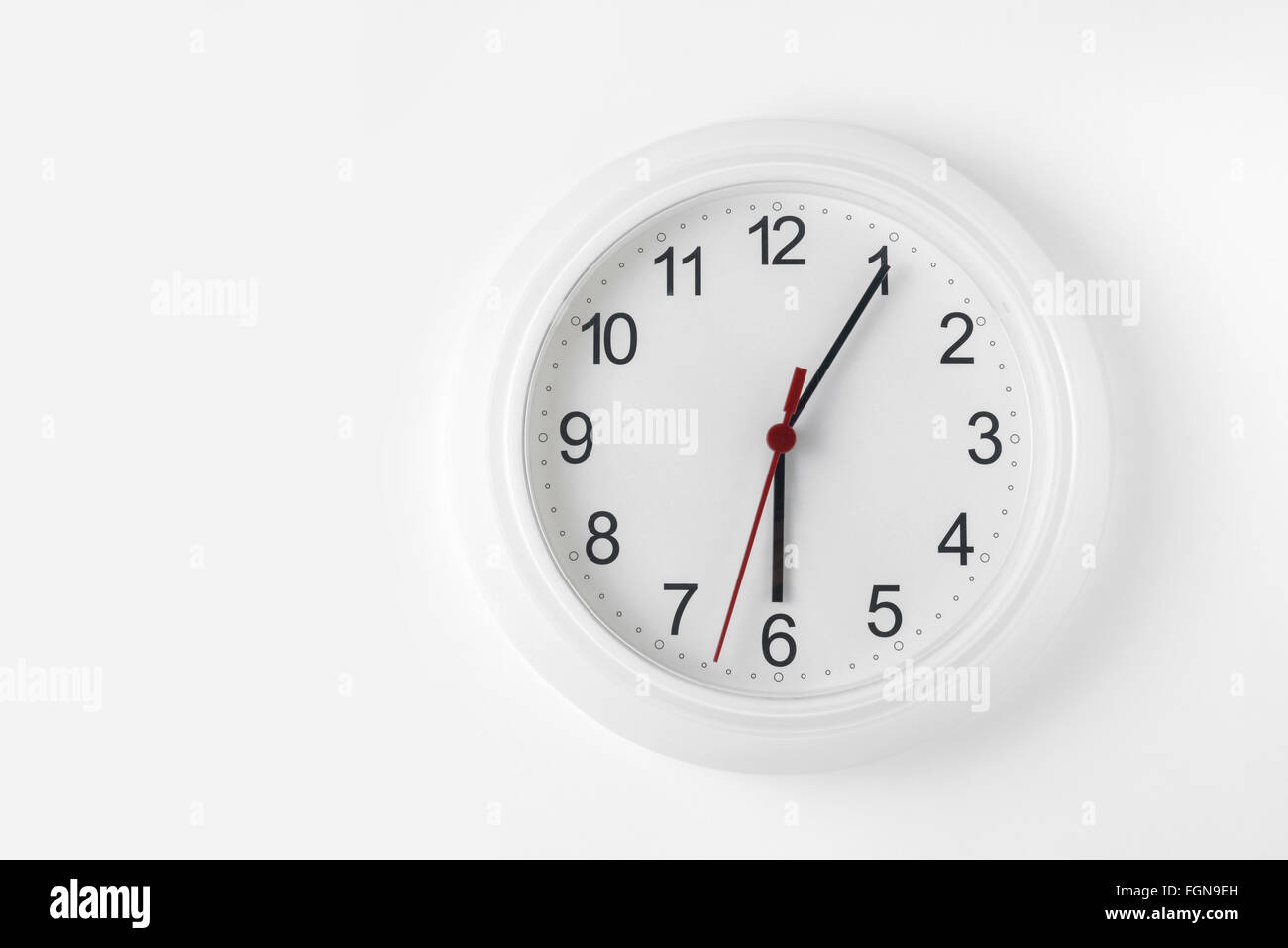 clock on white wall Stock Photo Alamy