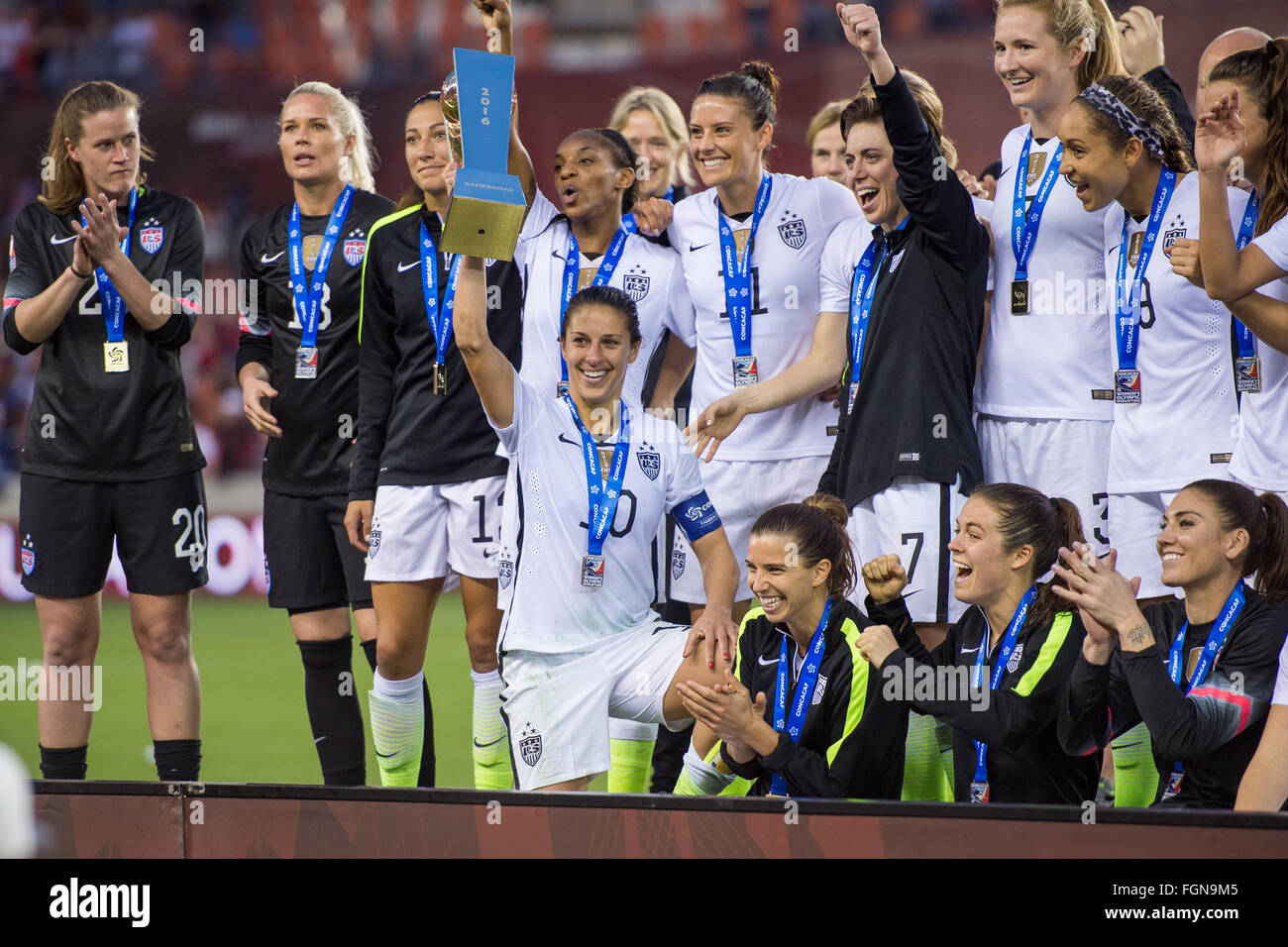 Houston, TX, USA. 21st Feb, 2016. United States midfielder Carli Lloyd (10) holds up the Championship trophy after the Final match of the CONCACAF Olympic Qualifying tournament between Canada and the USA at BBVA Compass Stadium in Houston, TX. USA won 2-0.Trask Smith/CSM/Alamy Live News Stock Photo