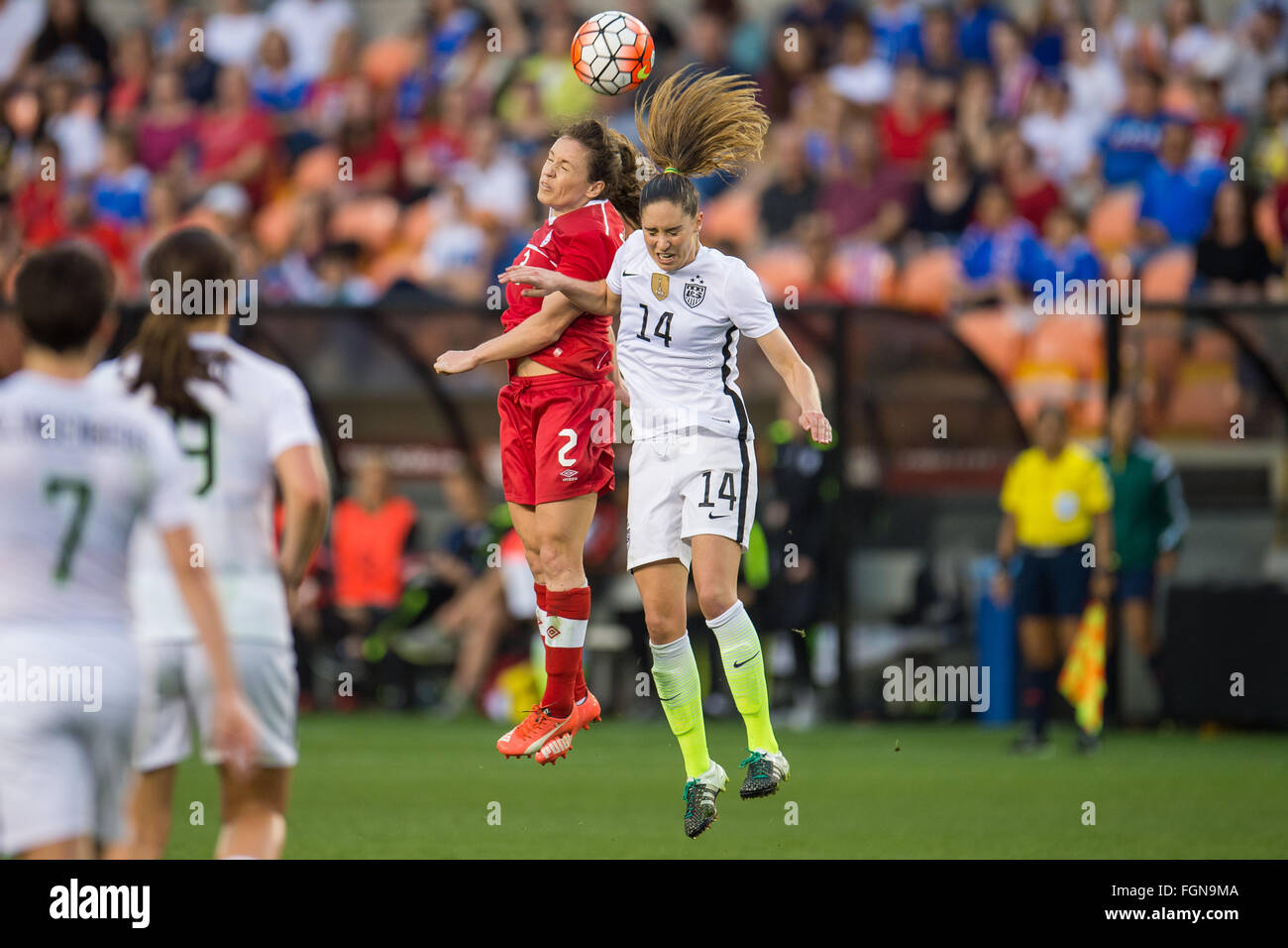Houston, TX, USA. 21st Feb, 2016. United States midfielder Morgan Brian (14) and Canada defender Allysha Chapman (2) battle for a header during the Final match of the CONCACAF Olympic Qualifying tournament between Canada and the USA at BBVA Compass Stadium in Houston, TX. USA won 2-0.Trask Smith/CSM/Alamy Live News Stock Photo