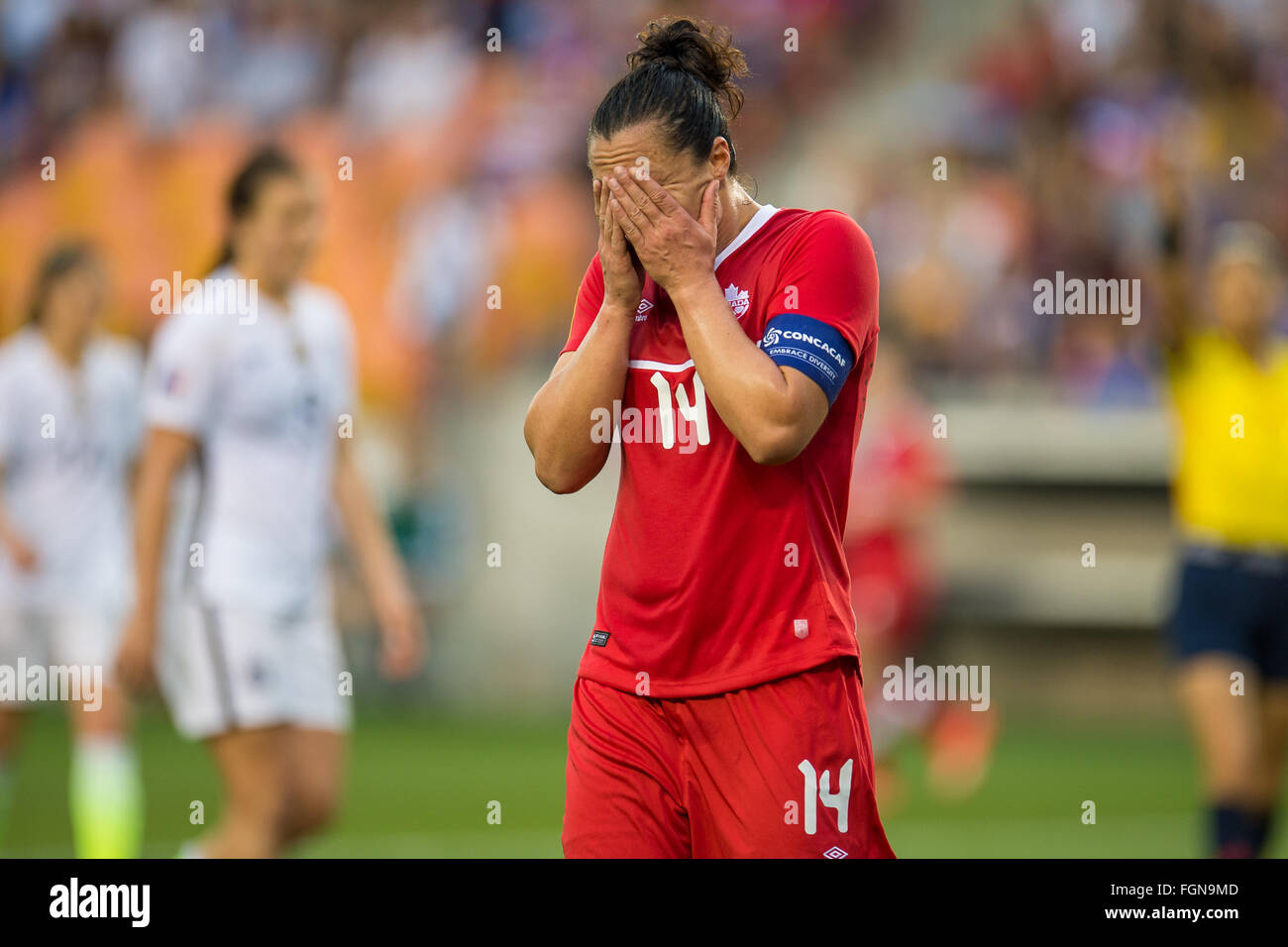 Houston, TX, USA. 21st Feb, 2016. Canada forward Melissa Tancredi (14) reacts after missing a goal during the Final match of the CONCACAF Olympic Qualifying tournament between Canada and the USA at BBVA Compass Stadium in Houston, TX. USA won 2-0.Trask Smith/CSM/Alamy Live News Stock Photo