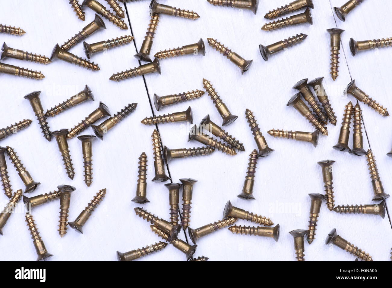 Group of brass screws on metal background Stock Photo Alamy