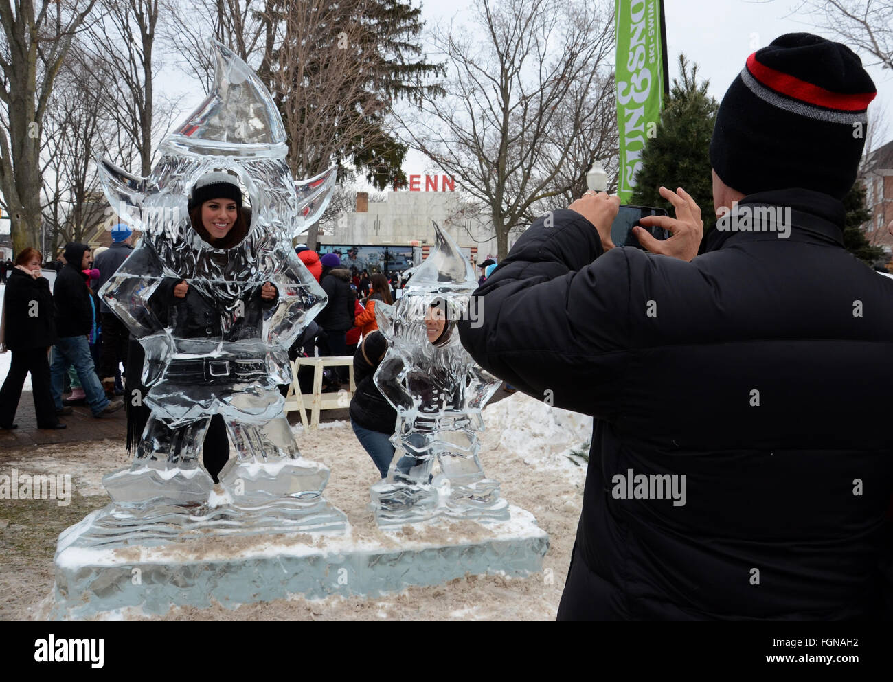 PLYMOUTH, MI - JANUARY 11: A man photographing two people at the