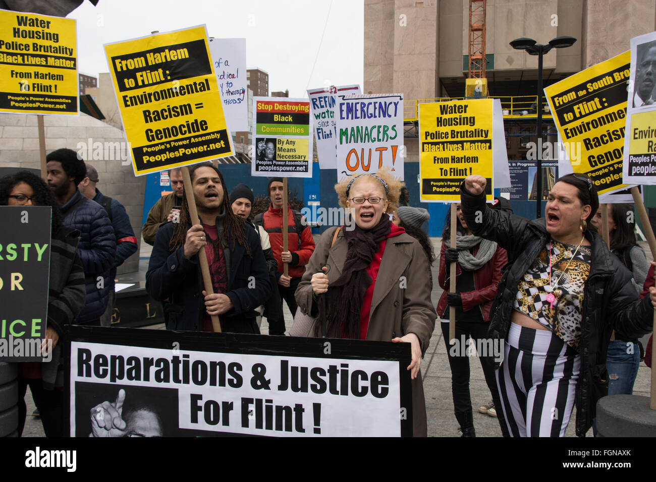 Harlem, New York, USA. 21st February 2016. A coalition of Black Lives Matter and environmental justice activists rallied and marched in Harlem on the anniversary of the assassination of Malcolm X blaming Flint, Michigan's water crisis on racism and environmental injustice. They rallied at the the Adam Clayton Powell Jr. Office Building, site of many speeches by the late Harlem political icon Malcolm X. Stock Photo