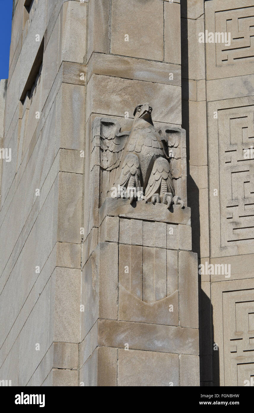Art deco eagle face on old bank building Stock Photo - Alamy