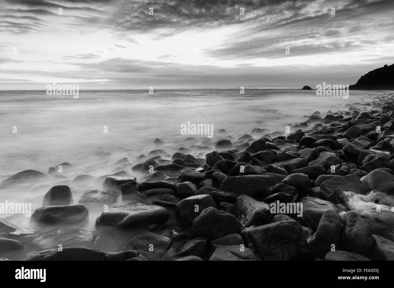 Boulders on the beach Stock Photo - Alamy