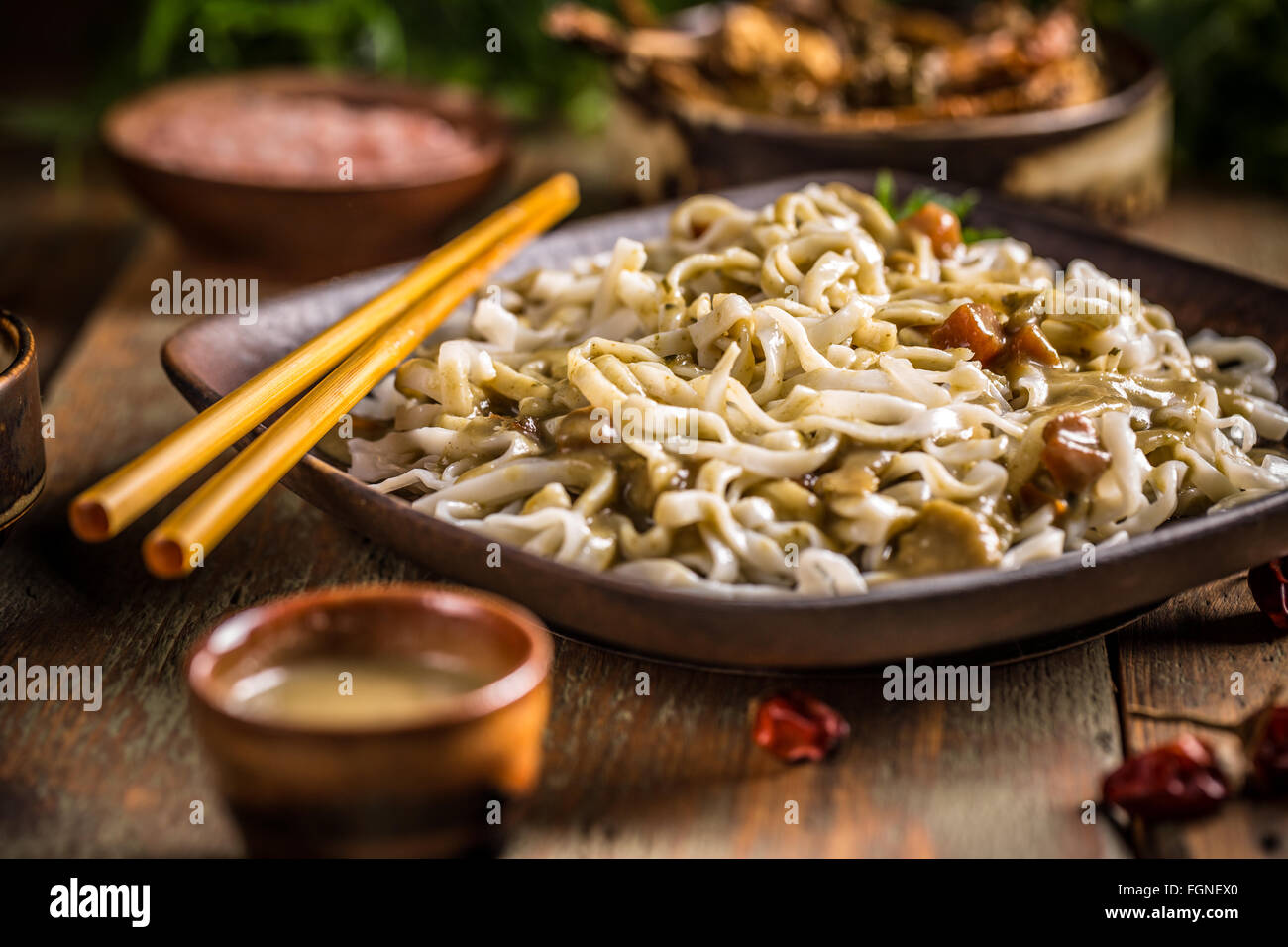 Thai noodles served in restaurant with chopsticks Stock Photo Alamy