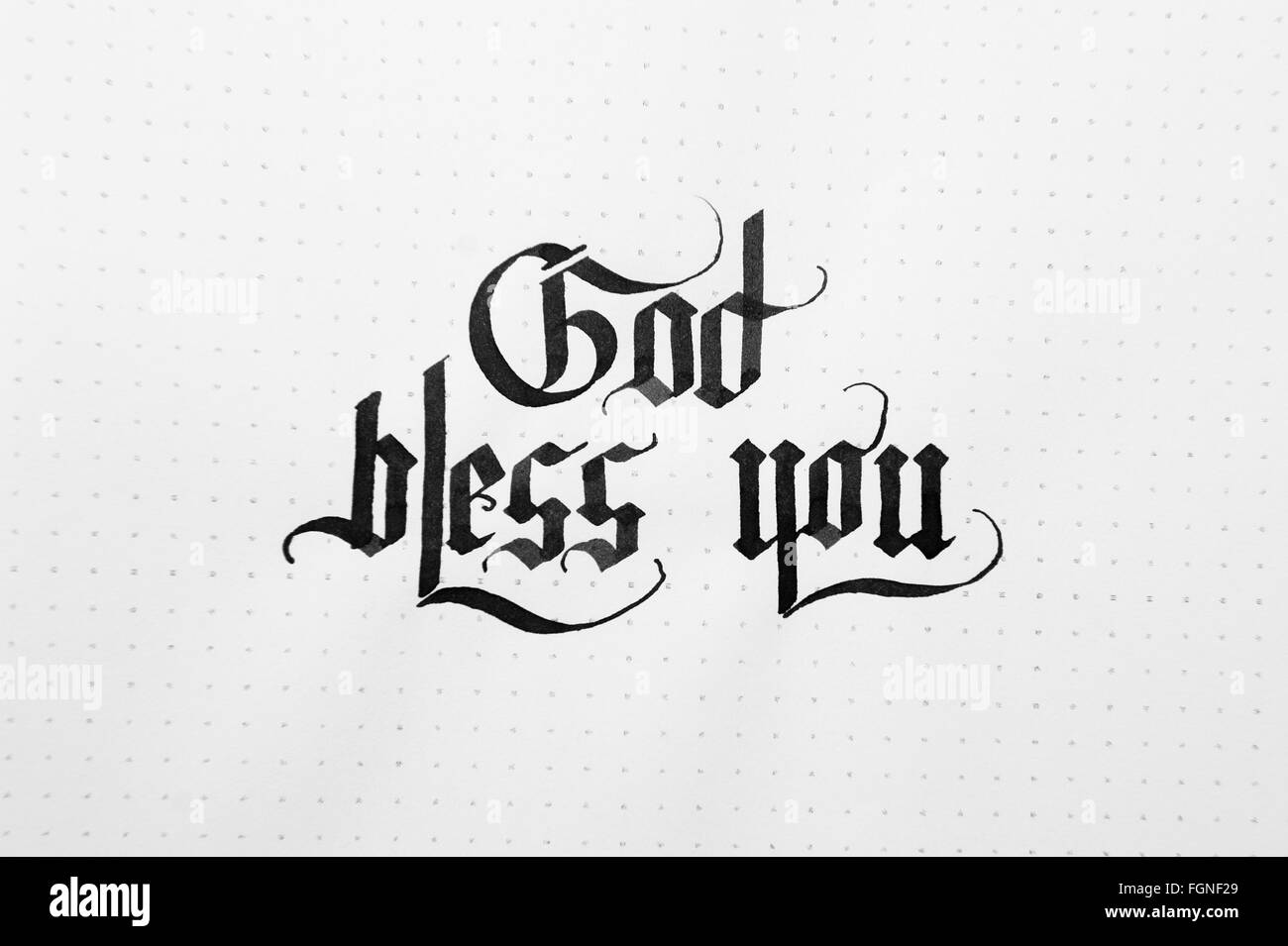 Calligraphical lettering God bless you on the paper note texture background Stock Photo