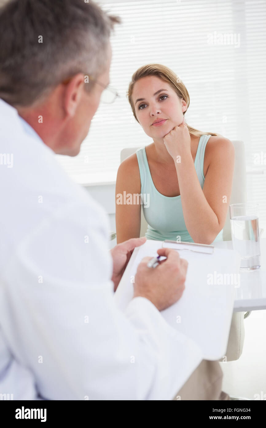 Woman tells doctor hi-res stock photography and images - Alamy