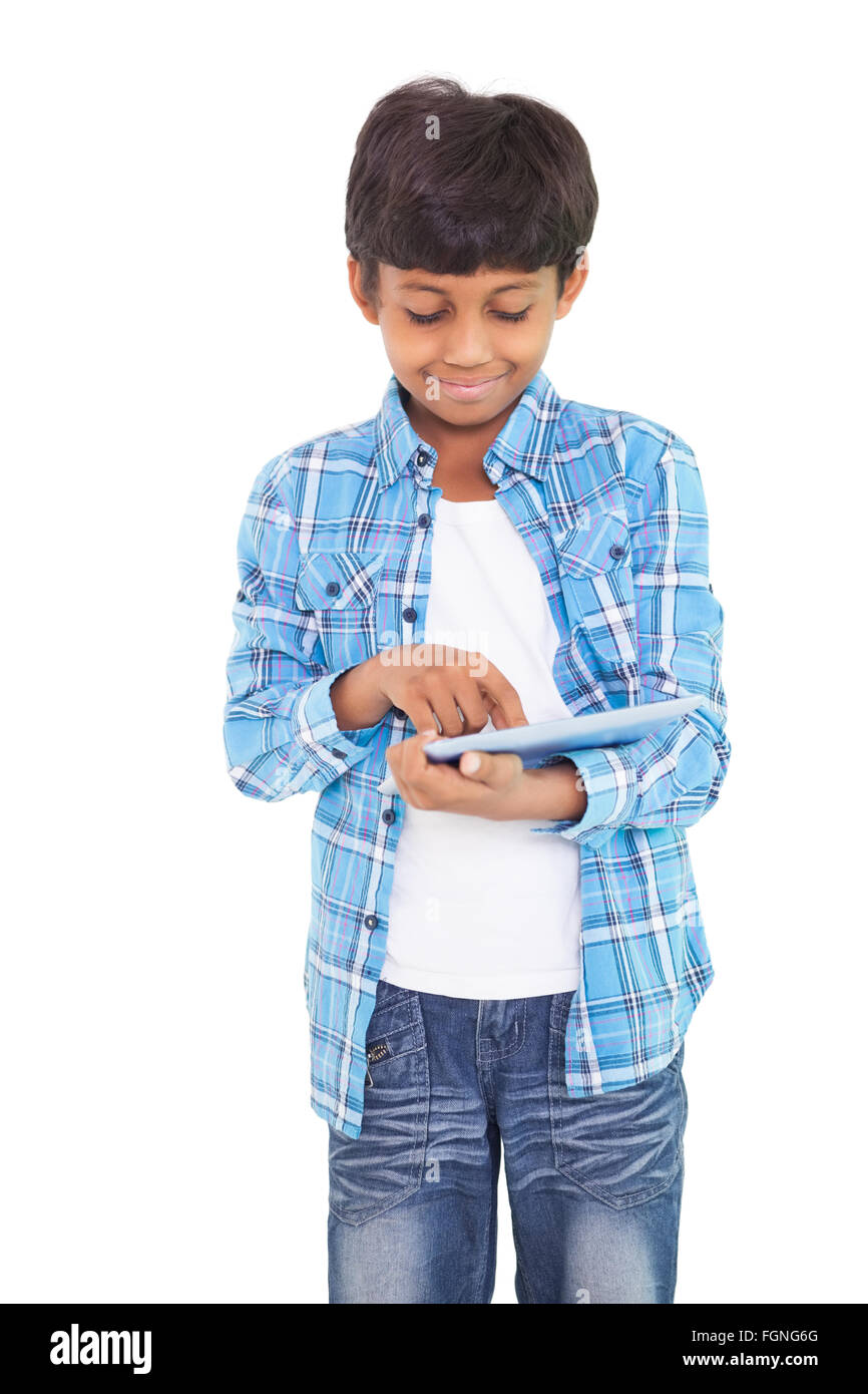 Cute boy using his tablet pc Stock Photo - Alamy