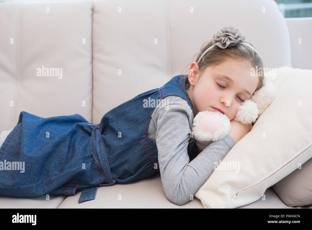 Little girl napping on the couch Stock Photo - Alamy