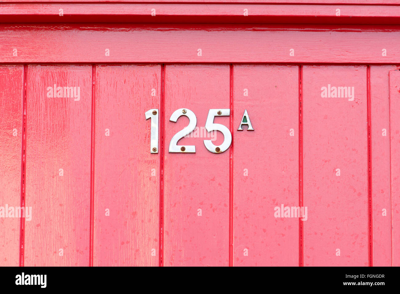 125A House number sign on door Stock Photo