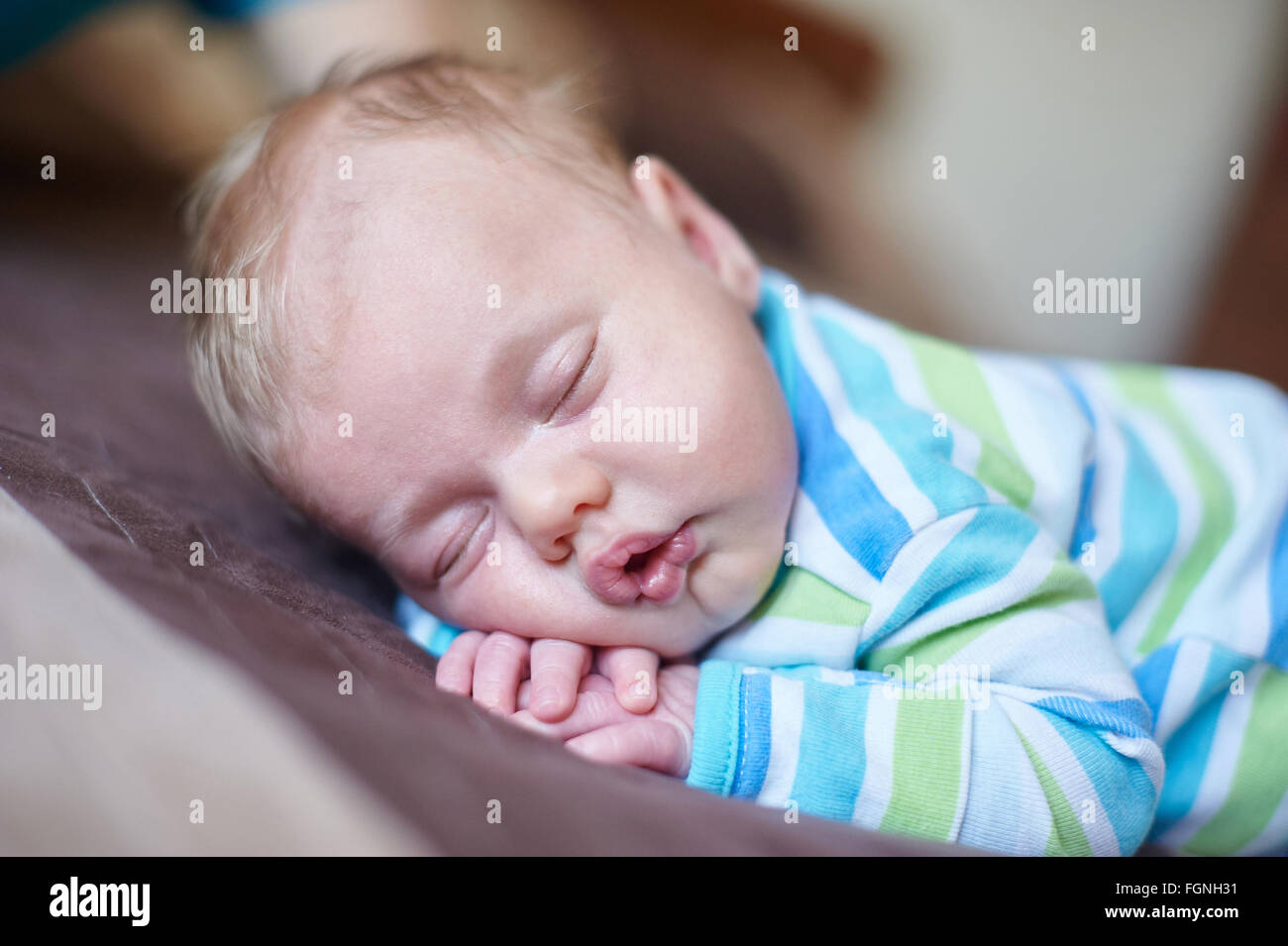 Little baby boy sleeping on his stomach in the bed Stock Photo Alamy